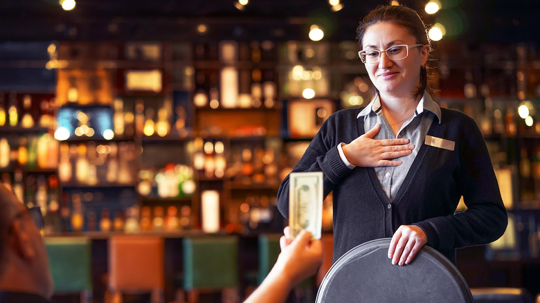 waitress accepts tip