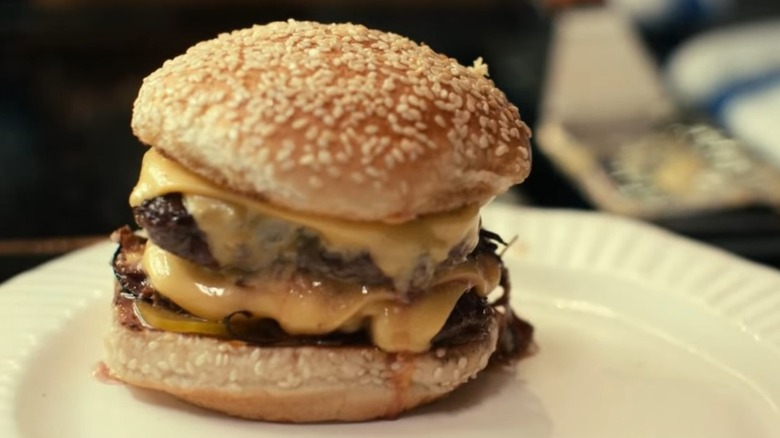 cheeseburger on sesame seed bun