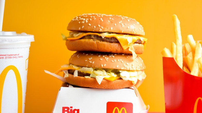 Two McDonald's cheeseburgers with sides