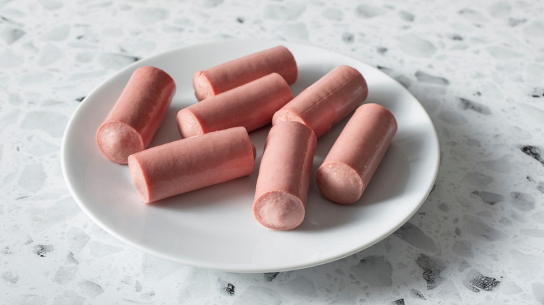 Vienna sausages on white plate