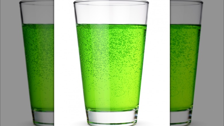 Green carbonated liquid in glass