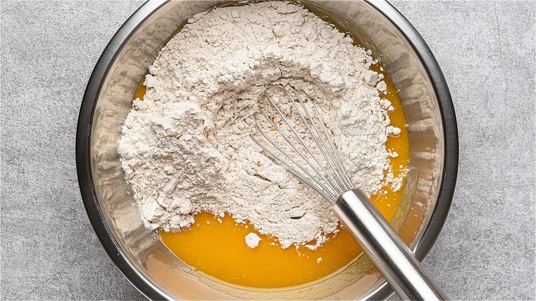 whisk in bowl of flour