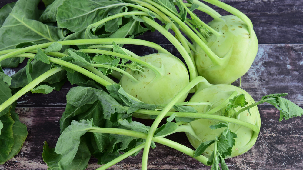 fresh kohlrabi on a wooden surface 