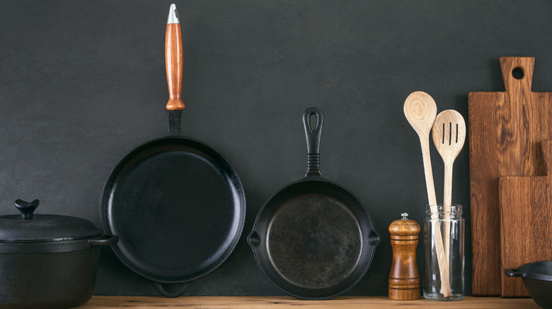 Cast iron skillets against the wall