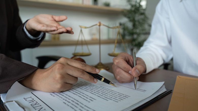 Person signing contract