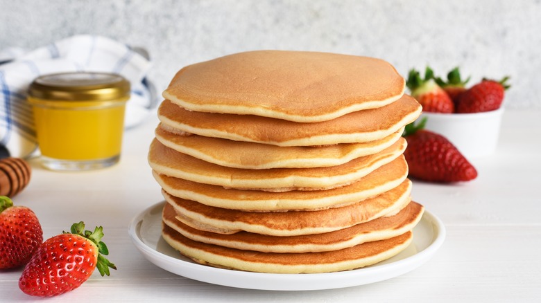 stack of pancakes with strawberries