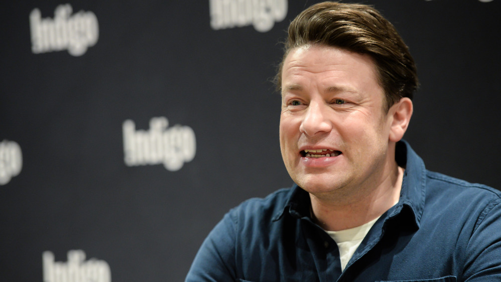 Close up of Jamie Oliver wearing blue shirt and smiling