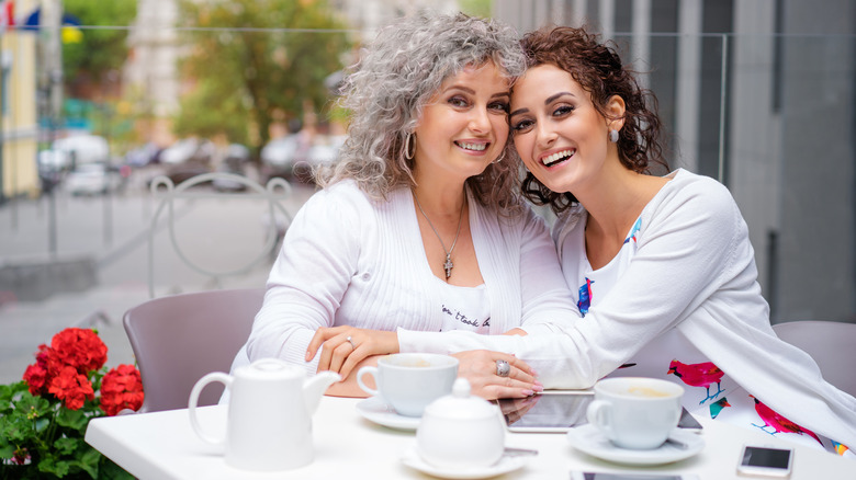 Woman and adult daughter in restaurant