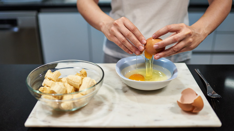 Preparing banana and egg pancakes