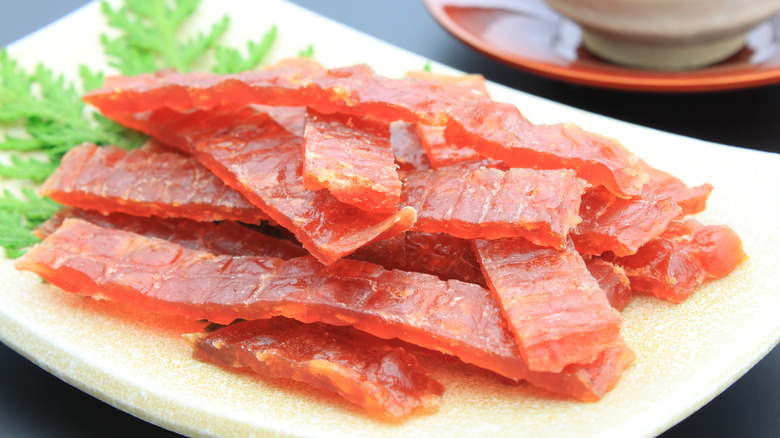 Salmon jerky strips on plate