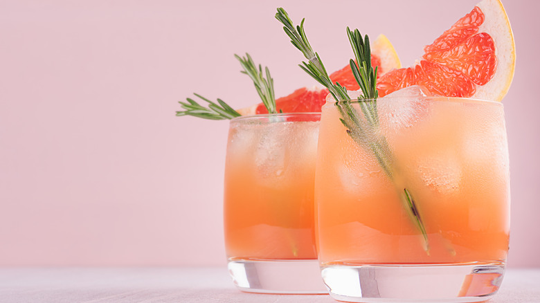 Grapefruit mocktail on pink background