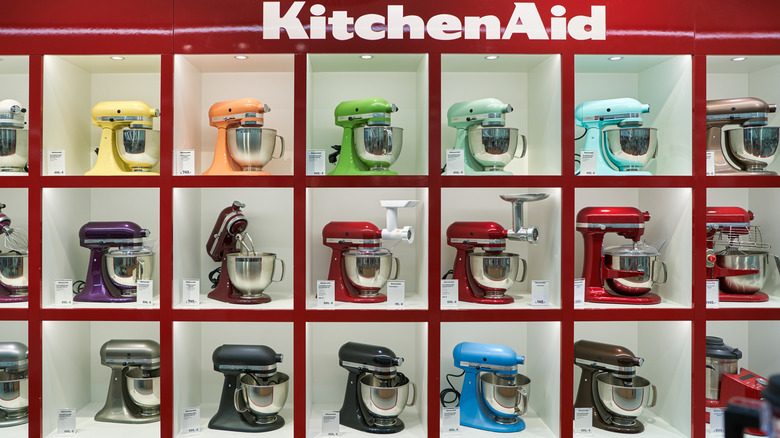 Display of KitchenAid stand mixers in various colors