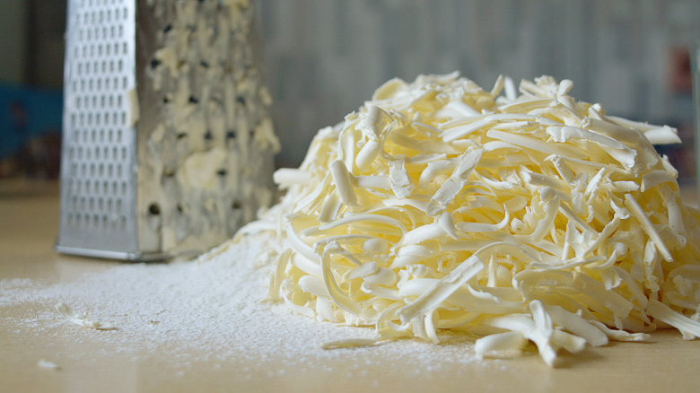 Box grater and grated butter