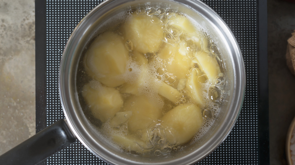 Boiled potatoes in pot