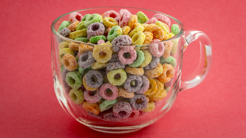 Froot loops in a mug on a red background