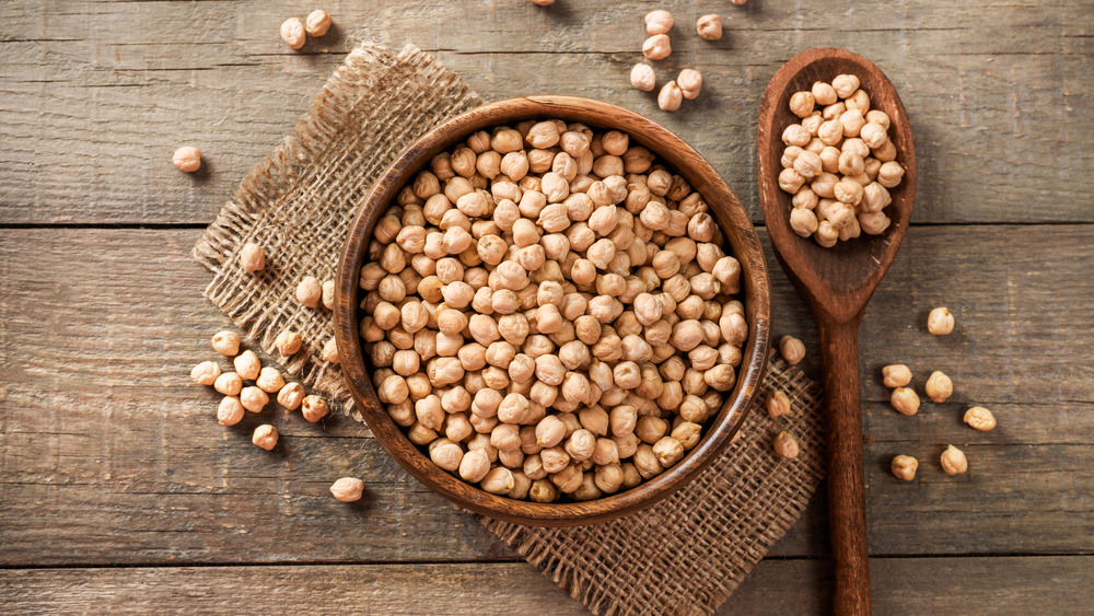 Bowl of chickpeas and wooden spoon