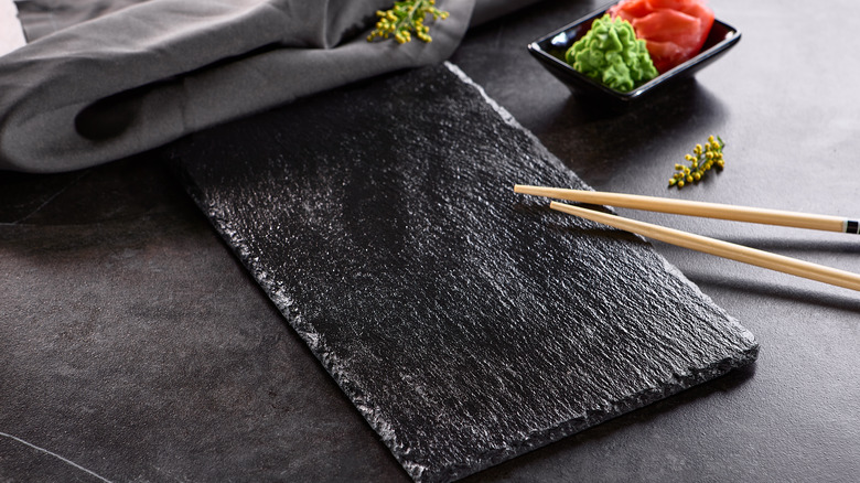 Chopsticks resting on serving dish