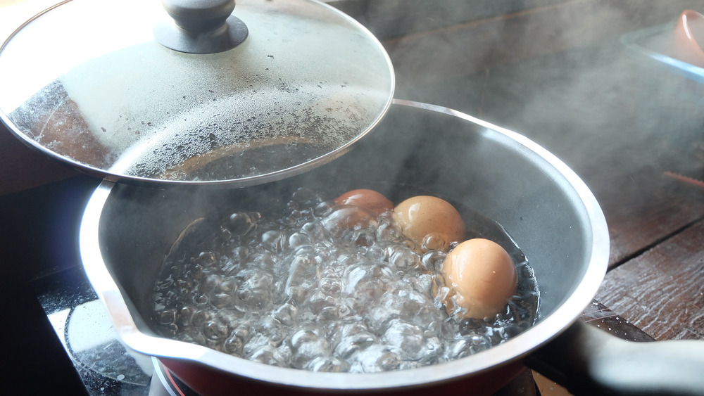 Boiling eggs in a pot of water