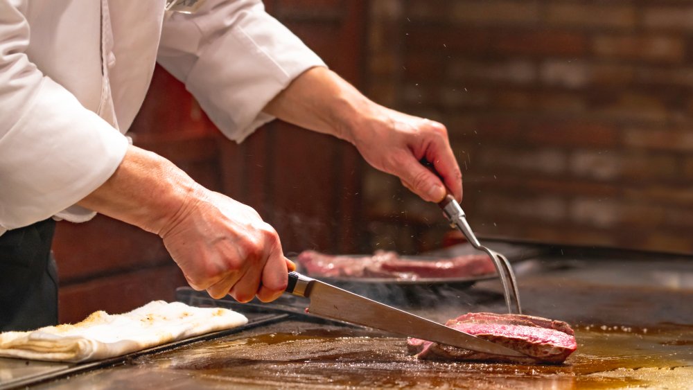 Japanese chef grilling Kobe beef