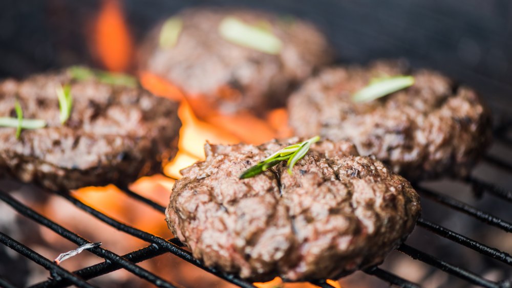 Burgers on a grill.