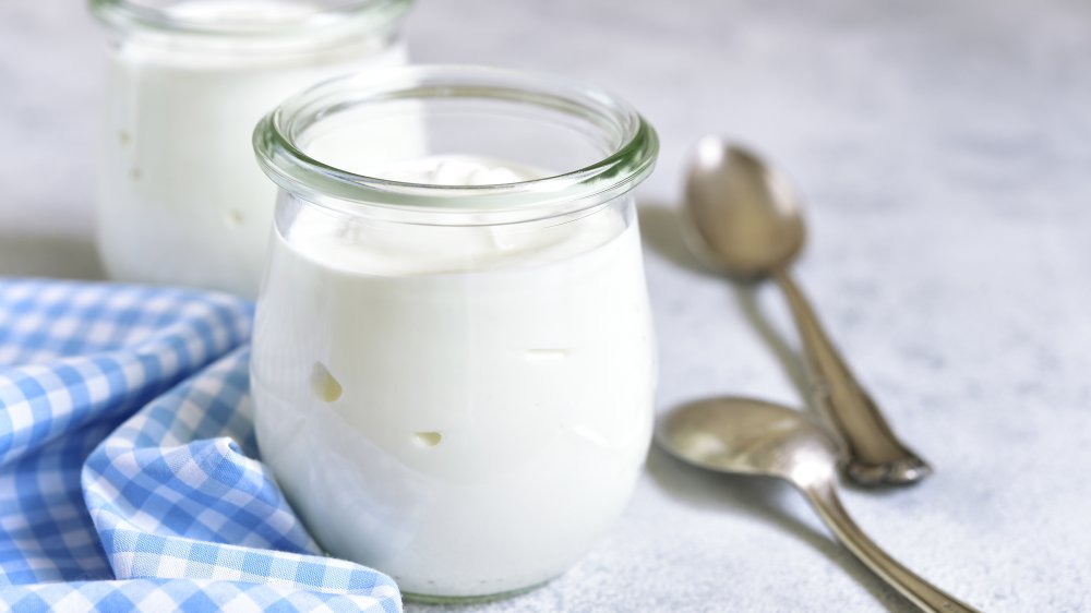 glass container of yogurt 