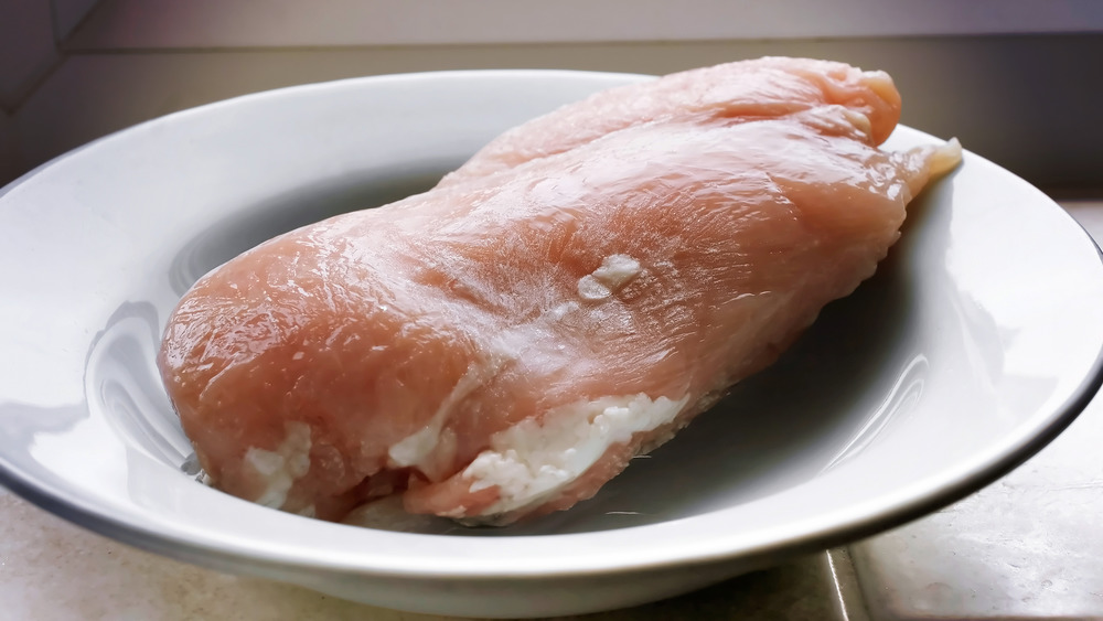 chicken breast thawing on counter