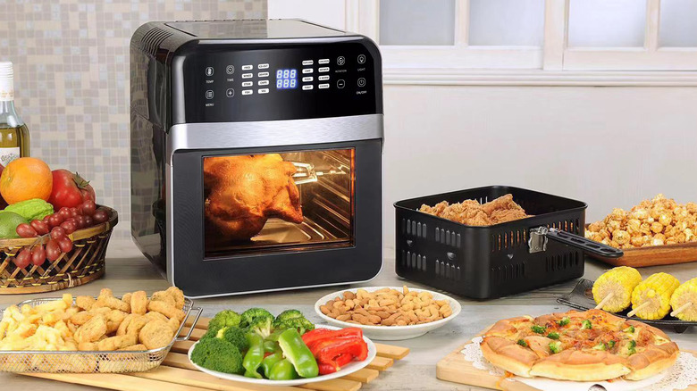 Air fryer surrounded by food