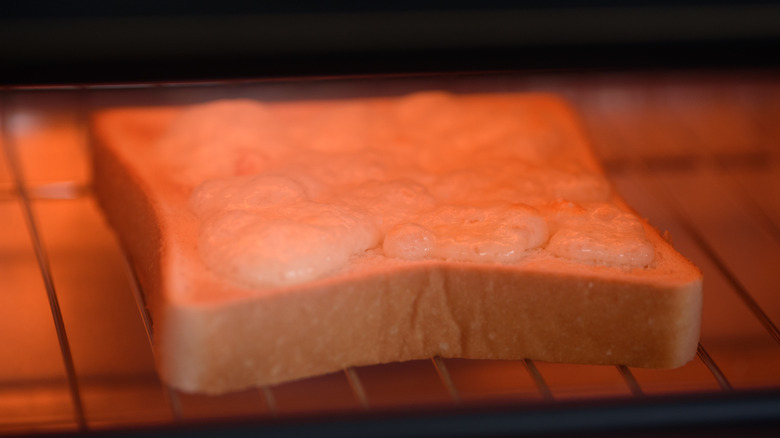 Bread toasting under an element