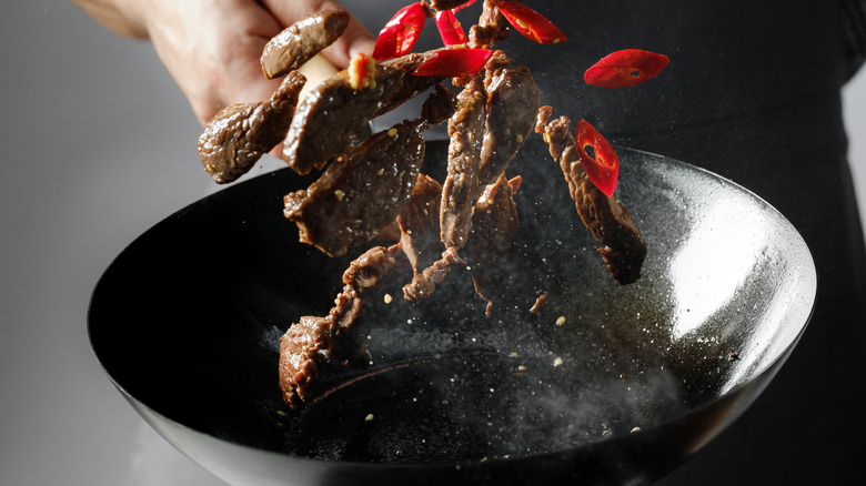 Stir-fry being tossed in a wok