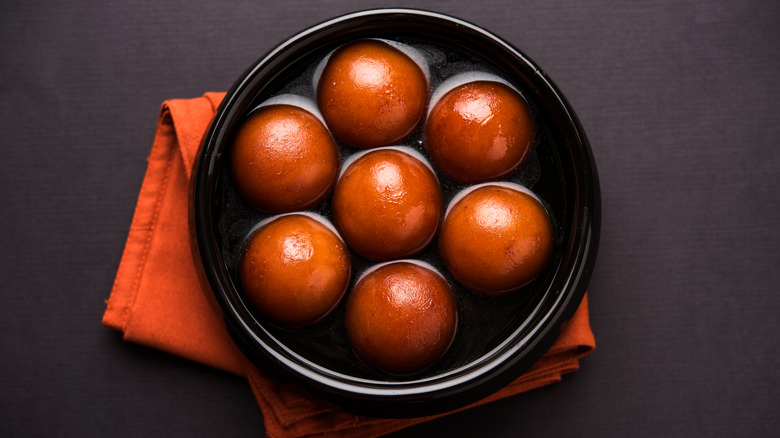 A serving of gulab jamun in a bowl