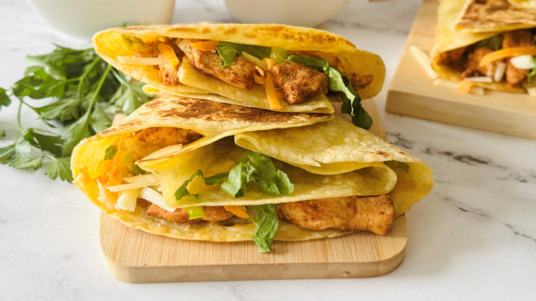Copycat Taco Bell chipotle ranch chicken stackers on wooden board