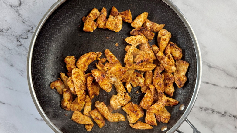 Cooked chicken in pan