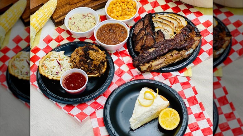 smoked meats and pie on table with checked napkins