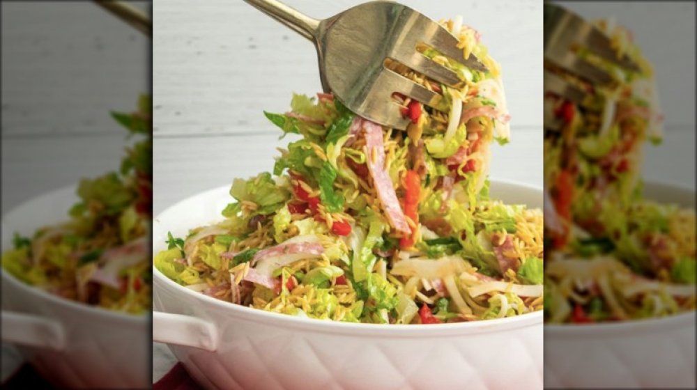 bowl of antipasti salad with fried orzo
