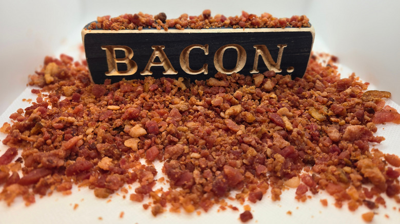 pile of bacon bits with sign reading "bacon"