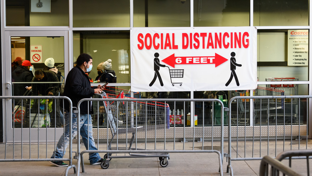 line for Costco with sign 