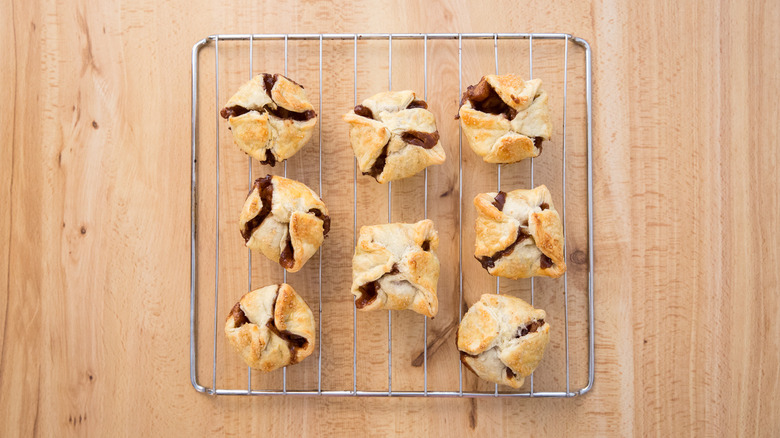 apple croissants on cooling rack