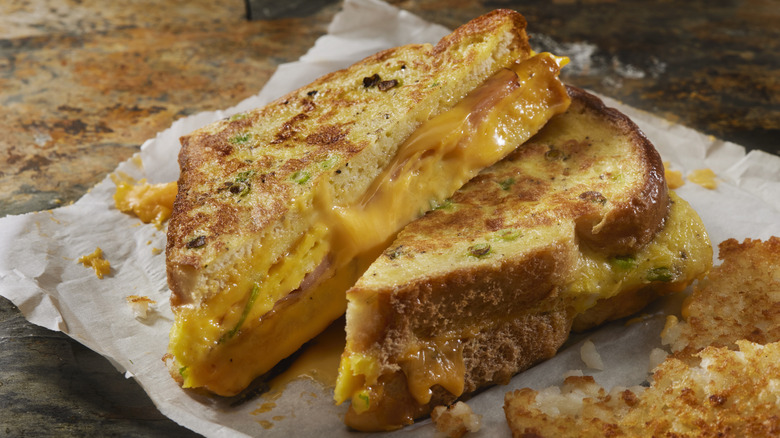 Grilled cheese sandwich with hashbrowns on side