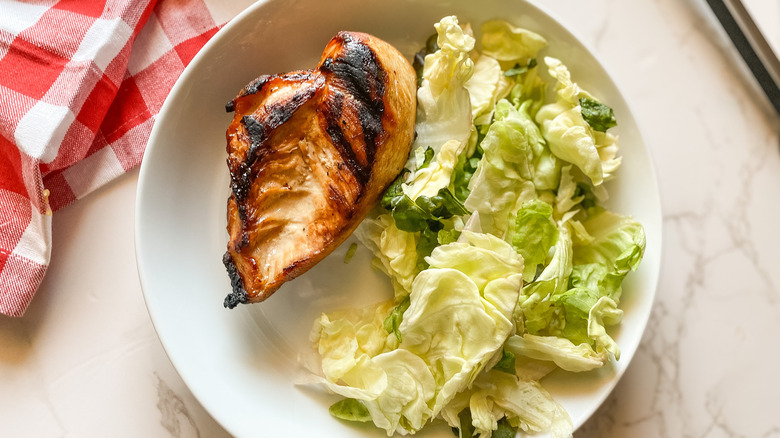 Grilled chicken and lettuce on plate