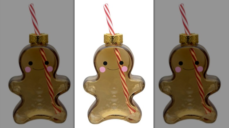 Gingerbread cookie shaped drinking glass with straw