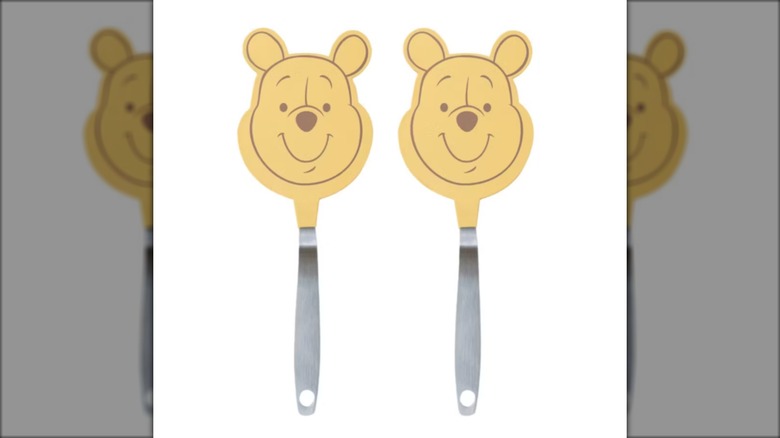 Two Winnie the Pooh -haped spatulas