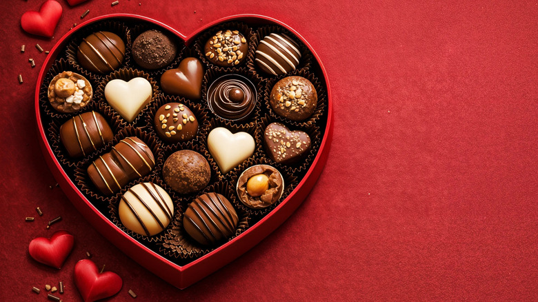 Valentine's chocolate heart box on red background