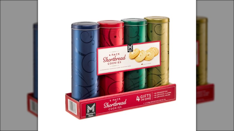 four tins containing shortbread cookies