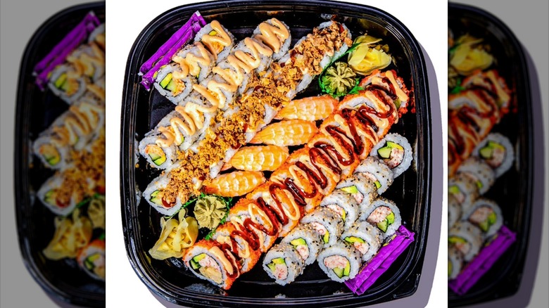 A closeup of a tray of Member's Mark sushi and rolls.