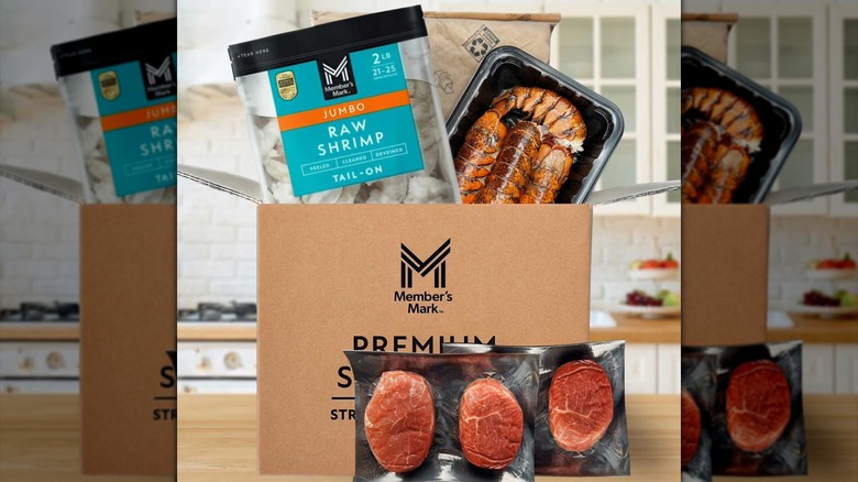 A photo of beef tenderloins, jumbo shrimp, and lobster tails near box