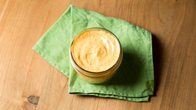 creamy orange sauce on table