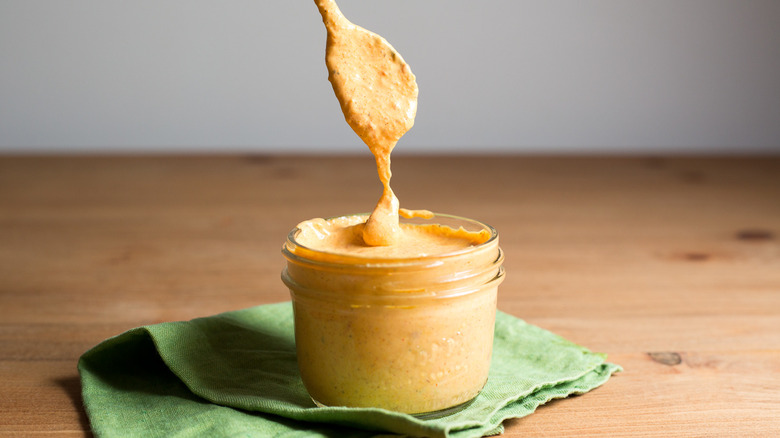 creamy sauce in small jar