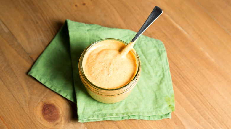 creamy orange sauce in jar