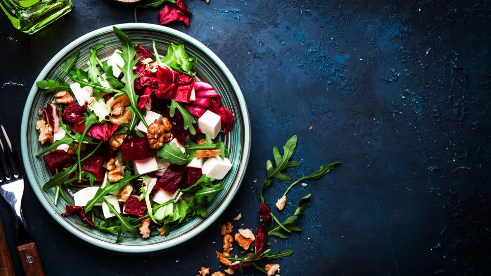 Healthy-looking salad with walnuts, beets, and cheese