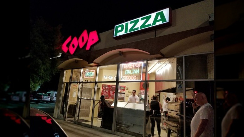 customers outside Coop Pizza Los Angeles at nighttime